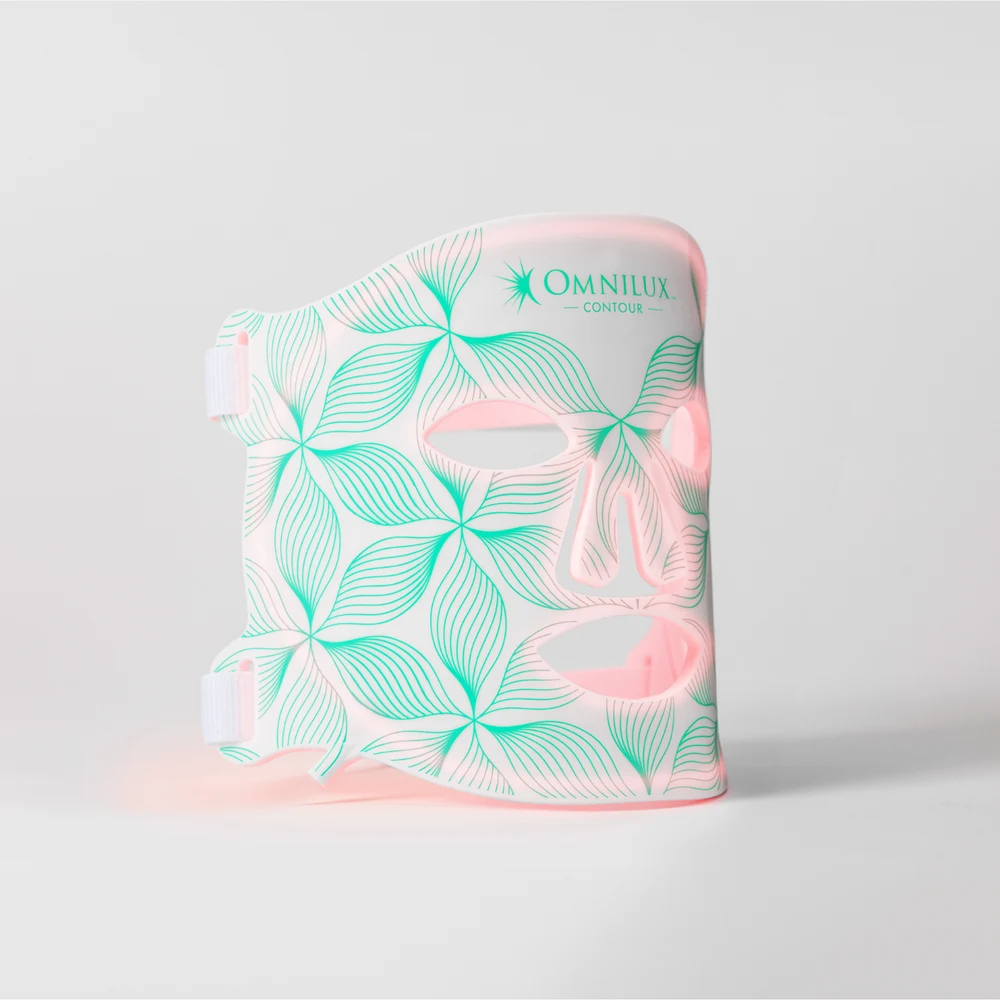 Omnilux Contour Face flexible LED mask standing upright, showing the branded silicone panel and illuminated red lights
