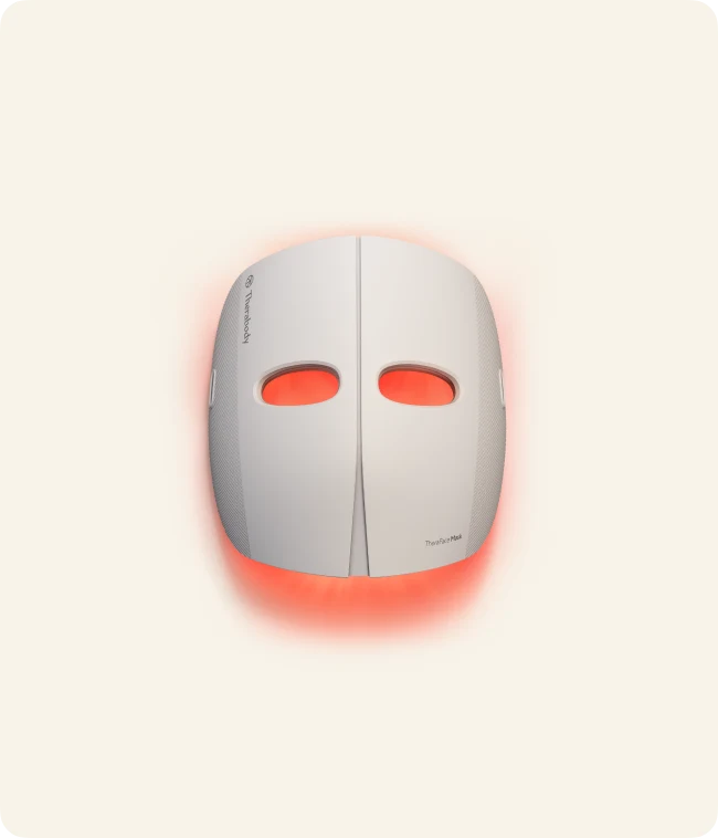 Original Therabody TheraFace Mask with illuminated eye openings, shown from the front